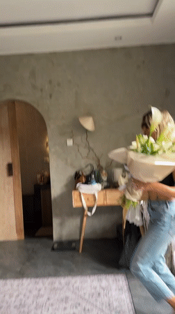 Women exchange flowers in intimate moment, North Kuta