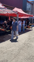 Woman shops at outdoor market in Gyumri, Armenia