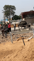 Women carry materials at Nigerian construction site