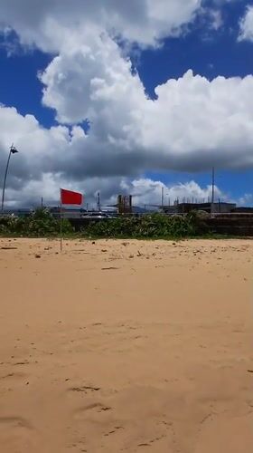 Beach conditions documented in Luquillo with red flag warning