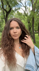 Woman documents casual morning walk through Moscow park