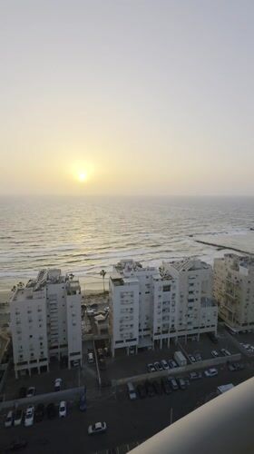 Quiet afternoon moments captured in Bat Yam: sunset, resting cat
