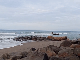 Coastal life documented in Lhokseumawe: fishing boat, container ship