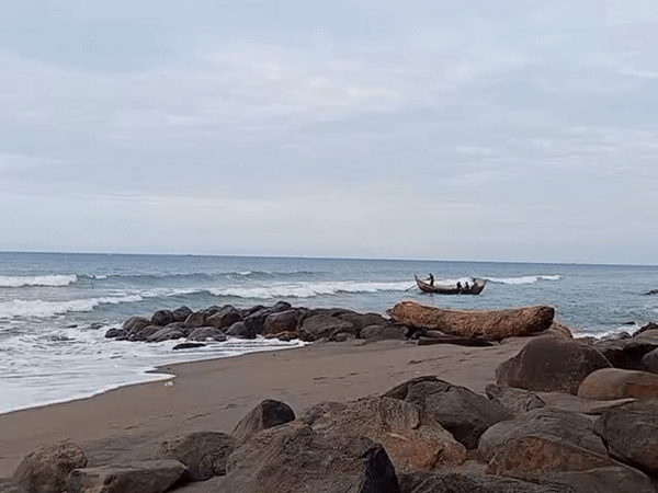 Coastal life documented in Lhokseumawe: fishing boat, container ship