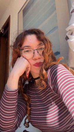 Woman records selfie videos in Barcelona interior setting