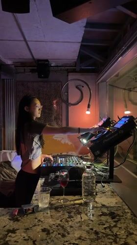 Female DJ performs afternoon set at Seoul bar venue