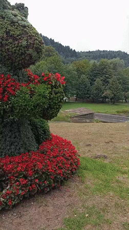 Floral animal sculpture on display in a Muszyna park