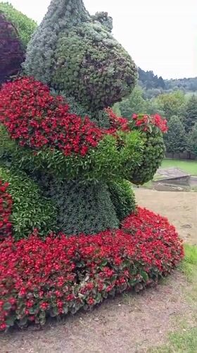 Floral animal sculpture on display in a Muszyna park