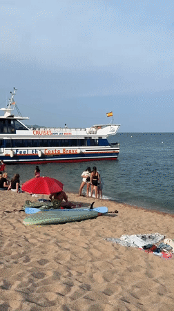 Busy summer afternoon at Blanes beach, Costa Brava