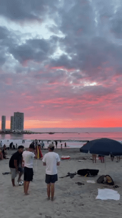 Evening beach gathering with vendors in Iquique, Chile