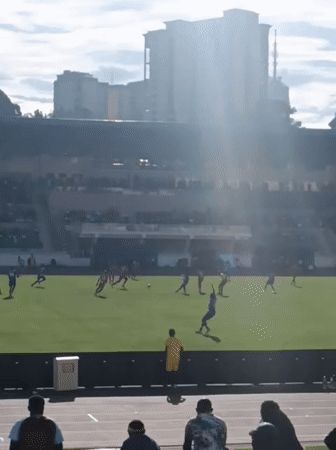 Soccer match underway at Nairobi stadium with spectators