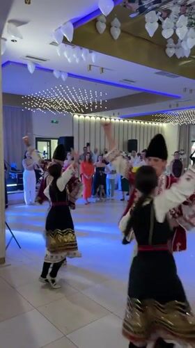 Wedding reception features traditional Bulgarian folk dancers in Serbia