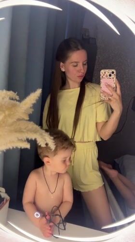 Mother and child capture mirror selfies in Klin bathroom