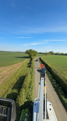 Heavy machinery operator records rural West Suffolk countryside view