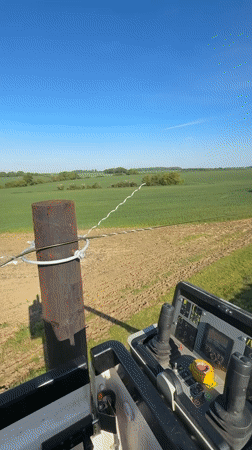 Heavy machinery operator records rural West Suffolk countryside view