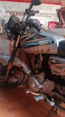 Resident documents motorcycle and pet dog in Venezuelan coastal town