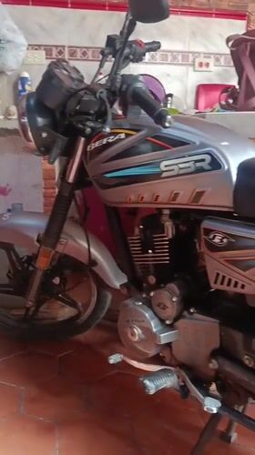 Resident documents motorcycle and pet dog in Venezuelan coastal town