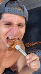 Man grills chicken wings, poses with flowers in Venezuela