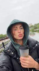 Rainy evening scene captured with woman and dog in Krasnoyarsk