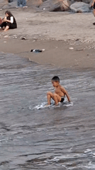 Families enjoy afternoon beach outing in Lhokseumawe, Indonesia