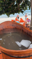 Family enjoys morning beach time at Thai resort