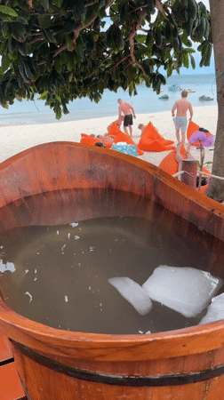 Family enjoys morning beach time at Thai resort