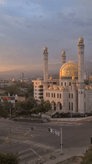 Golden hour falls over Almaty's skyline and mosque