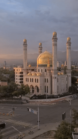 Golden hour falls over Almaty's skyline and mosque