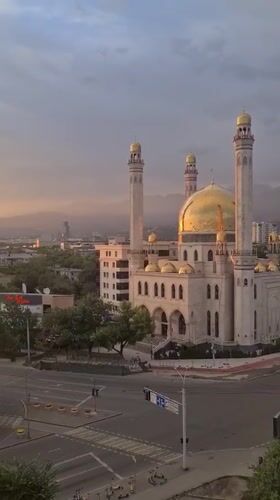Golden hour falls over Almaty's skyline and mosque