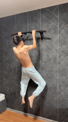 Couple exercises together using pull-up bar in Zav'yalovo