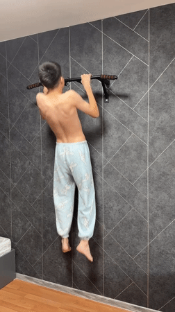 Couple exercises together using pull-up bar in Zav'yalovo