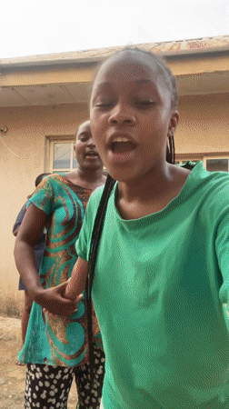 Dancing and selfies outside in Rafin Par, overcast Jos nearby