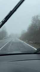 Driver navigates foggy, rainy road conditions in Bulgaria