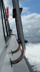 Passenger boat with child aboard travels through Indonesian waters