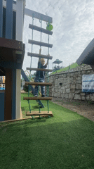 Playground afternoon in Danilovka, Altai, with wildflowers and slides