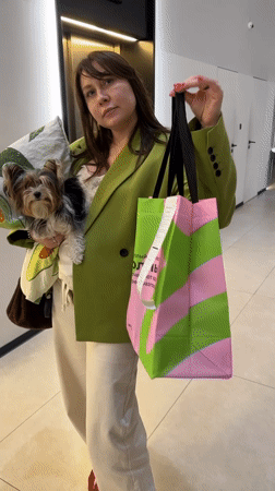 Woman with small dog spotted shopping in Moscow Sunday evening
