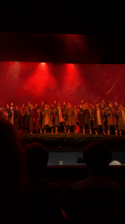 Moscow stage show: torches, smoke, and period costumes under red lights