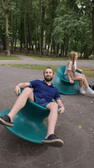 Sunny afternoon at a Ramenskoye park with spinning playground gear