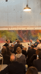 Jazz trio performs for seated audience in Paris venue