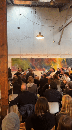 Jazz trio performs for seated audience in Paris venue