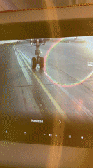 Passenger films landing gear camera feed during runway operations