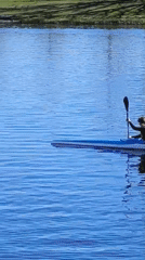 Two kayakers enjoy sunny morning on Jelgava waters