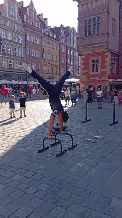 Calisthenics, limbo, and a vintage Škoda at Wrocław plaza