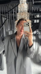 Woman takes selfies in formal attire at Russian locations