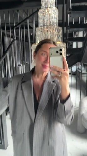 Woman takes selfies in formal attire at Russian locations