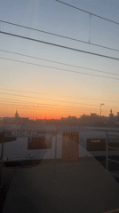 Sunset observed from moving train over Mechelen, Belgium