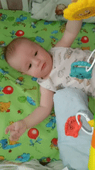 Baby's quiet moments captured in Tobolsk nursery