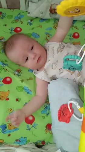 Baby's quiet moments captured in Tobolsk nursery