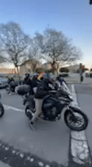 Motorcyclists accelerate through Jerez intersection during evening hours