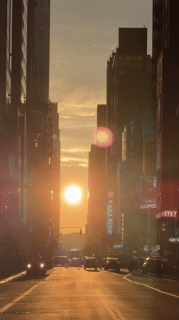 Times Square at sunset, then down into the 42nd Street subway